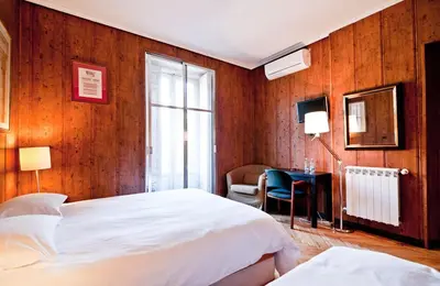 Cama o camas de una habitación en Hostal Asunción