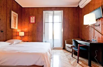 Cama o camas de una habitación en Hostal Asunción