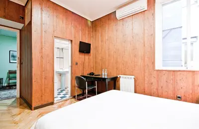 Cama o camas de una habitación en Hostal Asunción