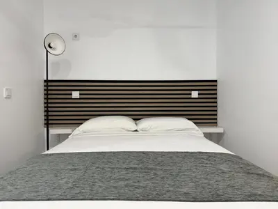 Cama o camas de una habitación en PlazaMayorSuites