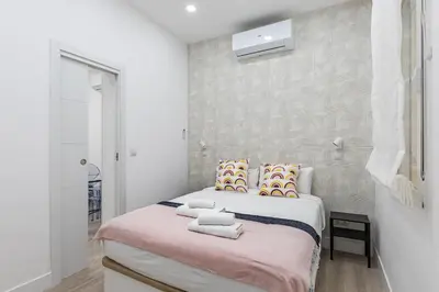 Cama o camas de una habitación en Waou Argüelles I - Alquiler Corta Duración