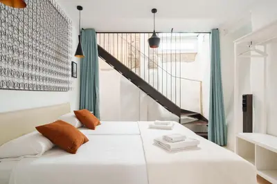 Cama o camas de una habitación en Cozy Loft Embajadores, 2rooms 2bathrooms