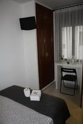 Cama o camas de una habitación en Hostal Rofer