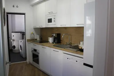 Una cocina o zona de cocina en APARTAHOTEL MADRID URBAN SUITES - EDIFICIO EXCLUSIVO- 7 Apartments Boutique Full Equiped