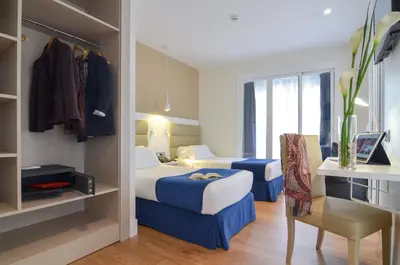 Cama o camas de una habitación en Hotel Miau