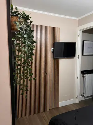 Una televisión o centro de entretenimiento en Room SestoA