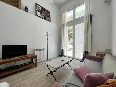 Una televisión o centro de entretenimiento en Temporal Azul Duplex M De