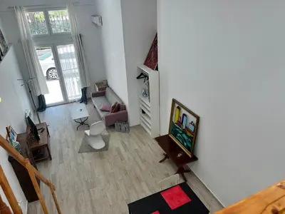 Una televisión o centro de entretenimiento en Temporal Azul Duplex M De