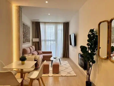 Una televisión o centro de entretenimiento en Apartamentos orilla del Bernabéu