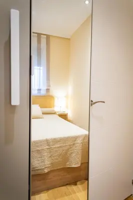 Cama o camas de una habitación en Encantador apartamento céntrico en Barrio Salamanca, junto a WiZink Center Movistar Arena y Plaza de Toros Las Ventas
