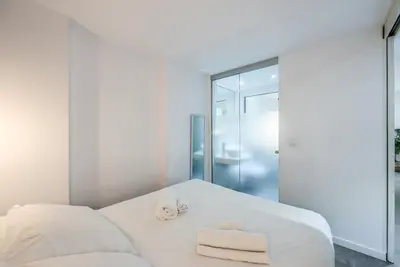 Cama o camas de una habitación en Salamanca Suites by ARCO