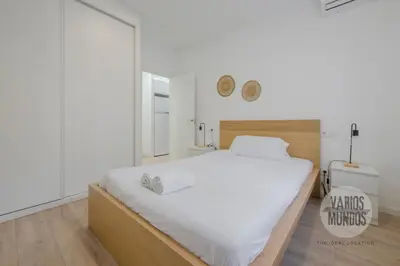 Cama o camas de una habitación en Confort con parking para 3, vive la Latina