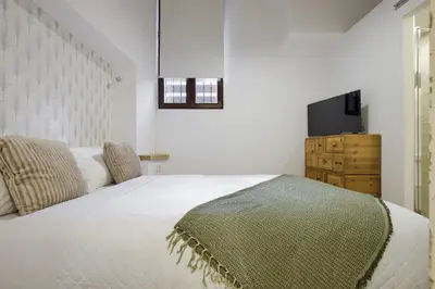 Cama o camas de una habitación en Espectaculares apartamentos centro Madrid
