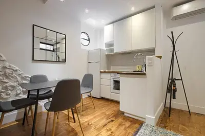 Una cocina o zona de cocina en Espectaculares apartamentos centro Madrid