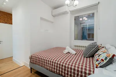 Cama o camas de una habitación en La Elegancia de Lagasca
