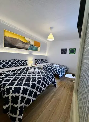 Cama o camas de una habitación en Gran Via Plaza Parking Silva