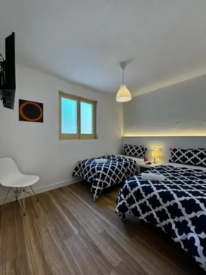 Cama o camas de una habitación en Gran Via Plaza Parking Silva