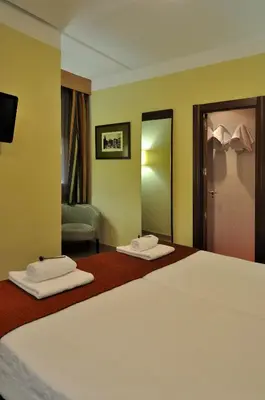 Cama o camas de una habitación en Hostal Ballesta