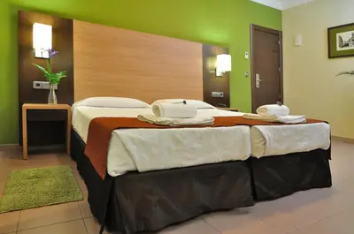 Cama o camas de una habitación en Hostal Ballesta