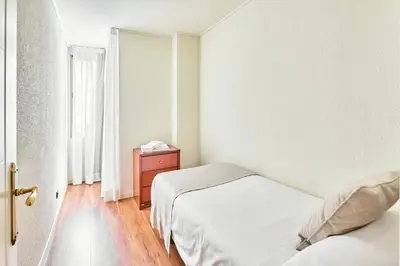 Cama o camas de una habitación en Apartamentos Juan Bravo