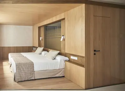 Cama o camas de una habitación en Apartamentos Juan Bravo