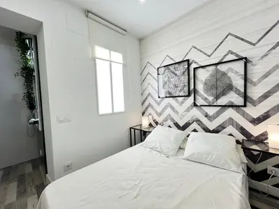 Cama o camas de una habitación en Acogedor Quintiliano Temporal