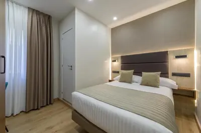 Cama o camas de una habitación en Hostal Sun Gate