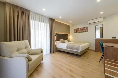 Cama o camas de una habitación en Hostal Sun Gate