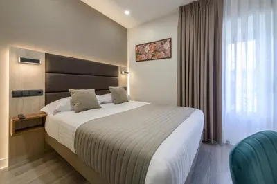 Cama o camas de una habitación en Hostal Sun Gate