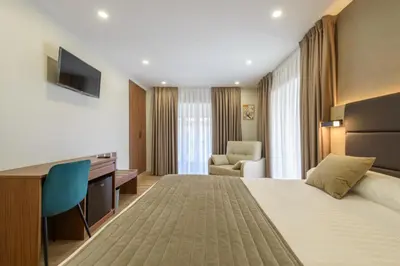Cama o camas de una habitación en Hostal Sun Gate