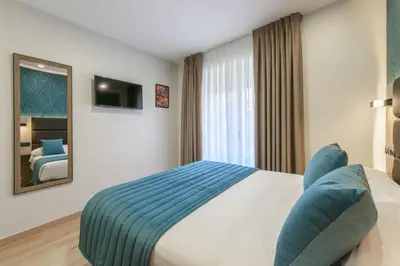 Cama o camas de una habitación en Hostal Sun Gate