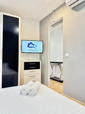 Cama o camas de una habitación en Apartamentos Day Madrid CALLAO II
