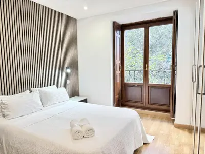 Cama o camas de una habitación en Apartamentos Day Madrid CALLAO II