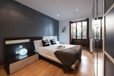 Cama o camas de una habitación en Apartamentos Day Madrid CALLAO II