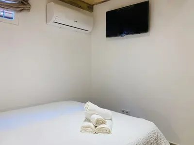 Cama o camas de una habitación en Modern Apartment III in Madrid