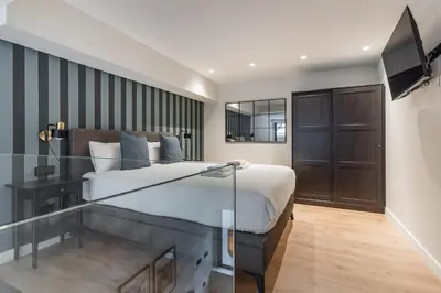 Cama o camas de una habitación en LAUREL-MintyStay Apartments