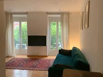 Una televisión o centro de entretenimiento en Luminosa Casa Lavapies 2 dormitorios