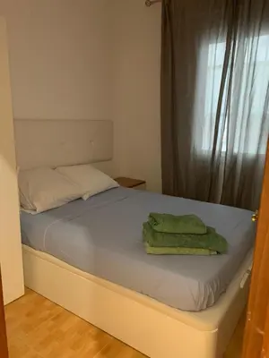 Cama o camas de una habitación en Luminosa Casa Lavapies 2 dormitorios