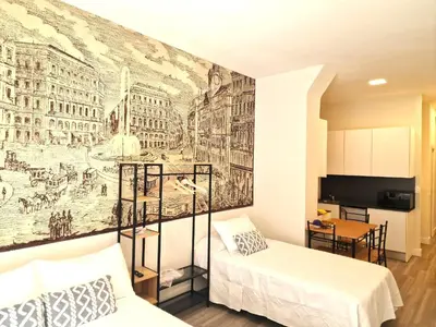 Cama o camas de una habitación en Madrid suites 3