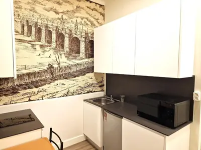 Una cocina o zona de cocina en Madrid suites 3