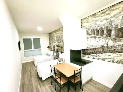 Cama o camas de una habitación en Madrid suites 3