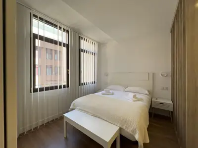 Cama o camas de una habitación en Apartamentos ALFISA Puerta del Sol