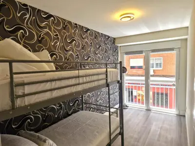 Cama o camas de una habitación en Madrid Suites