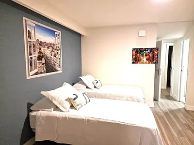 Cama o camas de una habitación en Madrid Suites