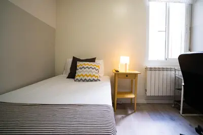 Cama o camas de una habitación en Smartliving Madrid Centro