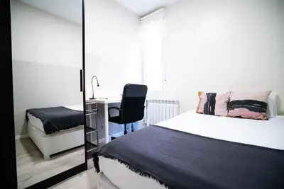Cama o camas de una habitación en Smartliving Madrid Centro