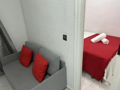 Cama o camas de una habitación en Una encantadora estancia en el centro Madrid