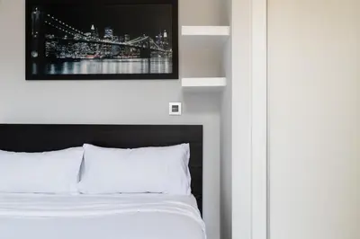 Cama o camas de una habitación en Encanto y Comfort en Habitaciones de Pilar de Zaragoza