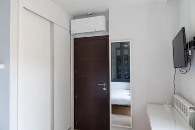 Cama o camas de una habitación en Encanto y Comfort en Habitaciones de Pilar de Zaragoza