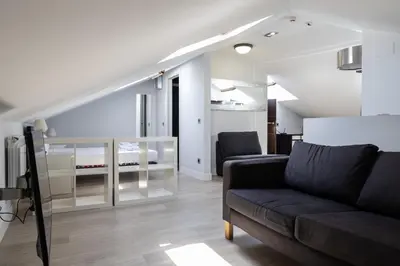 Zona de estar de Encanto y Comfort en Habitaciones de Pilar de Zaragoza